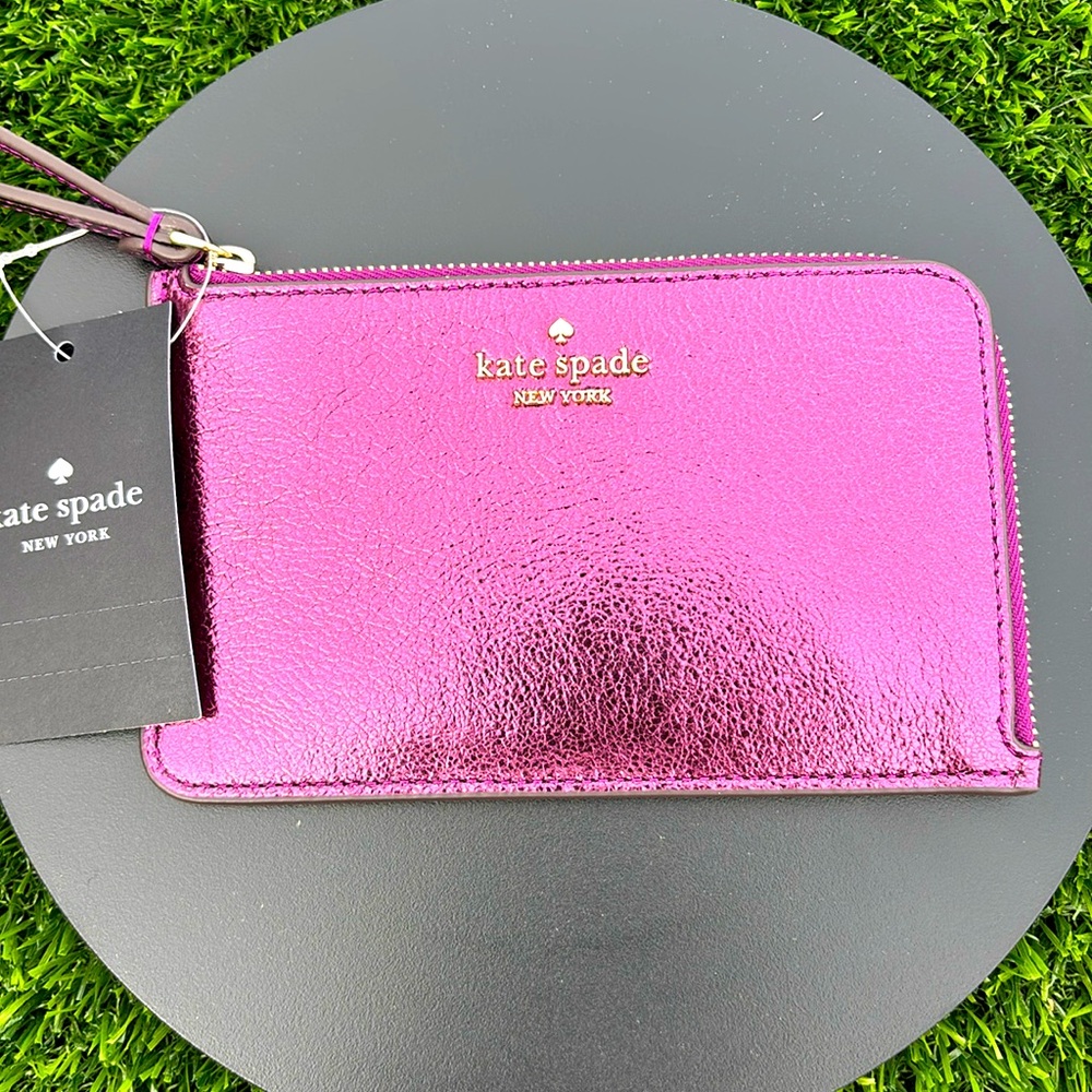 NWT Kate Spade small zip wristlet Lucy in dark raspberry color.
